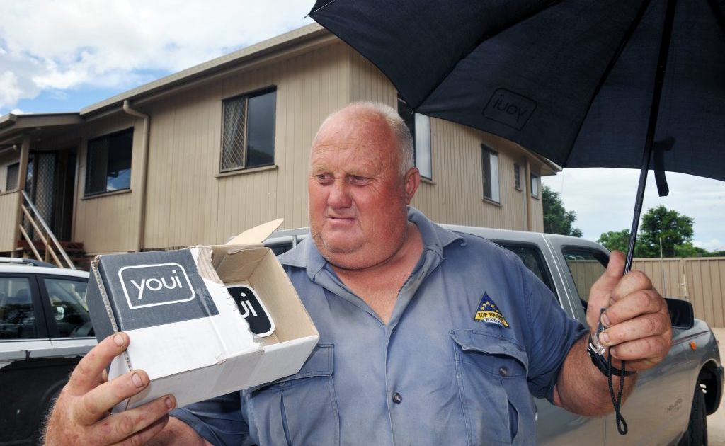 BAFFLES ME: Tom Orpin wonders what Youi was thinking when they sent him an umbrella in sympathy for the devastation his family suffered in the recent flood. Photo: Max Fleet / NewsMail BAFFLES ME: Tom Orpin wonders what Youi was thinking when they sent him an umbrella in sympathy for the devastation his family suffered in the recent flood. Photo: Max Fleet / NewsMail
