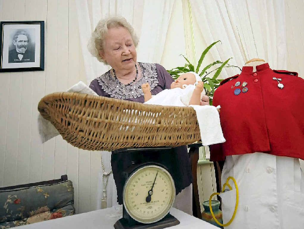 CORRECT WEIGHT: Vice president Ina Le Bas shows off the 1921 Hughes Baby Weigher from St Leonard’s Maternity Hospital in Alstonville.