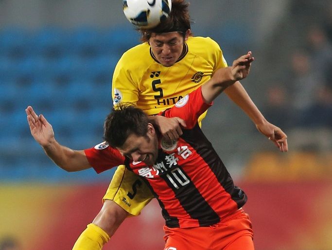 Zvjezdan Muslimovic (#10) of Guizhou Renhe competes for an aerial ball with Tatsuya Masushima of Kashiwa Reysol during the AFC Champions League match between Guizhou Renhe and Kashiwa Reysol at Olympic Sports Center on February 27, 2013 in Guiyang, China. Zvjezdan Muslimovic (#10) of Guizhou Renhe competes for an aerial ball with Tatsuya Masushima of Kashiwa Reysol during the AFC Champions League match between Guizhou Renhe and Kashiwa Reysol at Olympic Sports Center on February 27, 2013 in Guiyang, China.