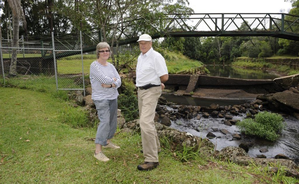 Christobel Munson and David Pont at the collapsed Bangalow Weir. They say continued inaction could see it disappear all together. Christobel Munson and David Pont at the collapsed Bangalow Weir. They say continued inaction could see it disappear all together.