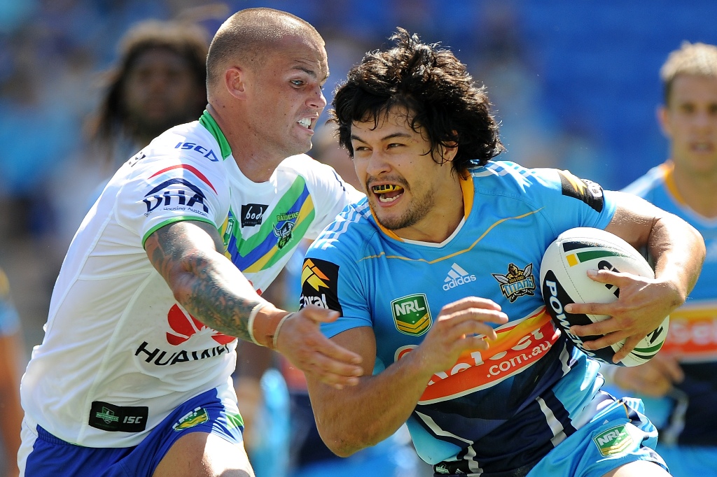 Kevin Gordon of the Titans is tackled durng the round two NRL match between the Gold Coast Titans and the Canberra Raiders at Skilled Park on March 17, 2013 on the Gold Coast, Australia. Kevin Gordon of the Titans is tackled durng the round two NRL match between the Gold Coast Titans and the Canberra Raiders at Skilled Park on March 17, 2013 on the Gold Coast, Australia.