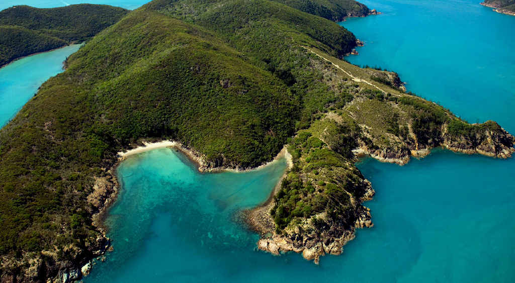 Escape Beach, on Hamilton Island, is protected by huge, rocky outcrops and only accessible by boat or on foot. Escape Beach, on Hamilton Island, is protected by huge, rocky outcrops and only accessible by boat or on foot.