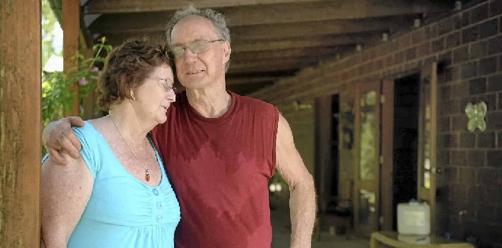 BATTLING ON: Kerie and Cliff Howlett are still cleaning up their damaged property after the Australia Day floods in Baffle Creek. BATTLING ON: Kerie and Cliff Howlett are still cleaning up their damaged property after the Australia Day floods in Baffle Creek.