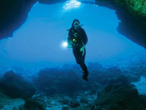 DIVE IN: A scuba diver explores Thundercliff Cave at Christmas Island. DIVE IN: A scuba diver explores Thundercliff Cave at Christmas Island.