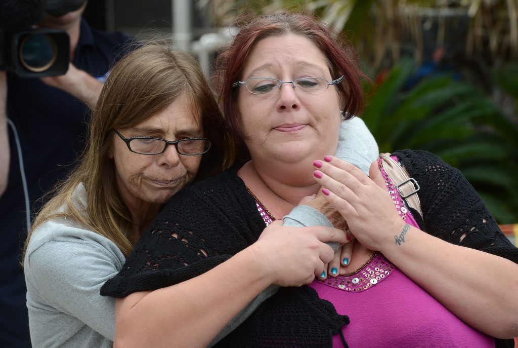 Debbie Sneddon (left), close friend of murdered nurse Wendy Evans, hugs Michelle Tuifufu (right), sister of Wendy Evans as they leave the Toowoomba courthouse. Debbie Sneddon (left), close friend of murdered nurse Wendy Evans, hugs Michelle Tuifufu (right), sister of Wendy Evans as they leave the Toowoomba courthouse.
