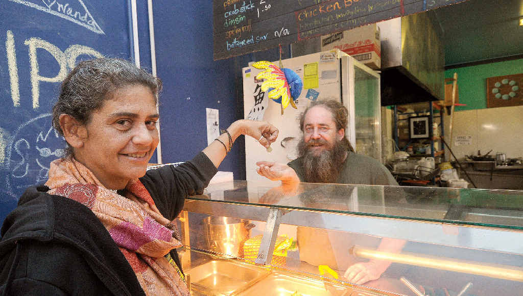 STONE FREE: Owner of Nimbin Stoned Fish, Justin Smith, pictured with Peta Johnson of Nimbin making a donation. Mr Smith is offering suspended meals at his cafe. STONE FREE: Owner of Nimbin Stoned Fish, Justin Smith, pictured with Peta Johnson of Nimbin making a donation. Mr Smith is offering suspended meals at his cafe.