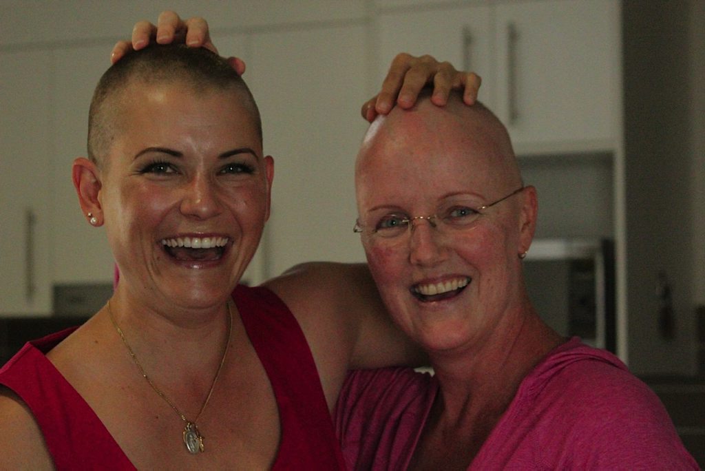Erica Smith (left) has given up her locks to support her close friend Lia Halsall (right), and to raise funds for The Wesley Hospital Kim Walters Choices Program. Photo: Contributed (Samantha Ashen) Erica Smith (left) has given up her locks to support her close friend Lia Halsall (right), and to raise funds for The Wesley Hospital Kim Walters Choices Program. Photo: Contributed (Samantha Ashen)