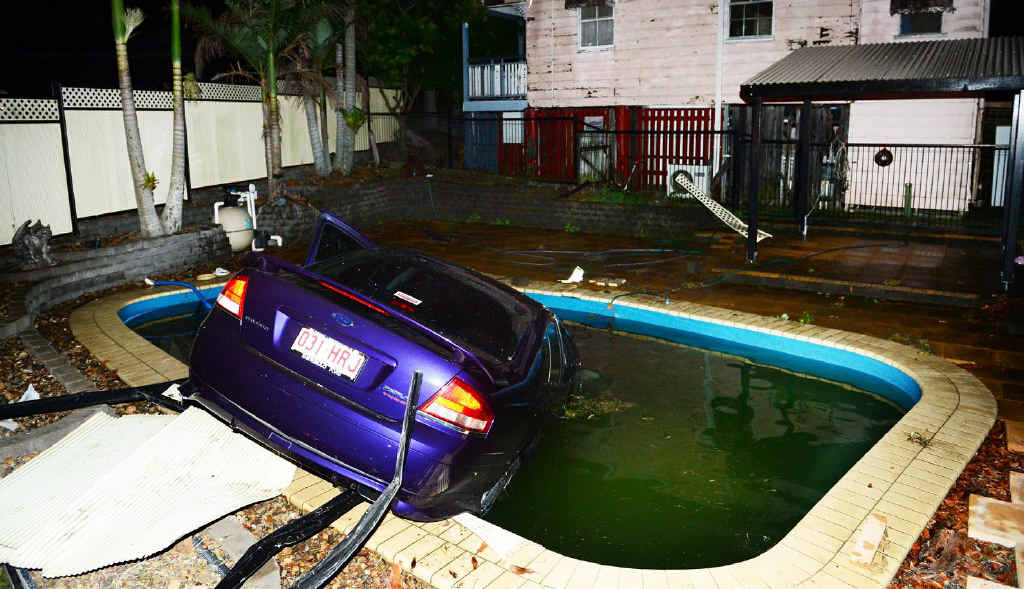 CAR WASH: A driver crashed his car through a fence and into a pool on the corner of Tudor and Challinor Street in West Ipswich. CAR WASH: A driver crashed his car through a fence and into a pool on the corner of Tudor and Challinor Street in West Ipswich.