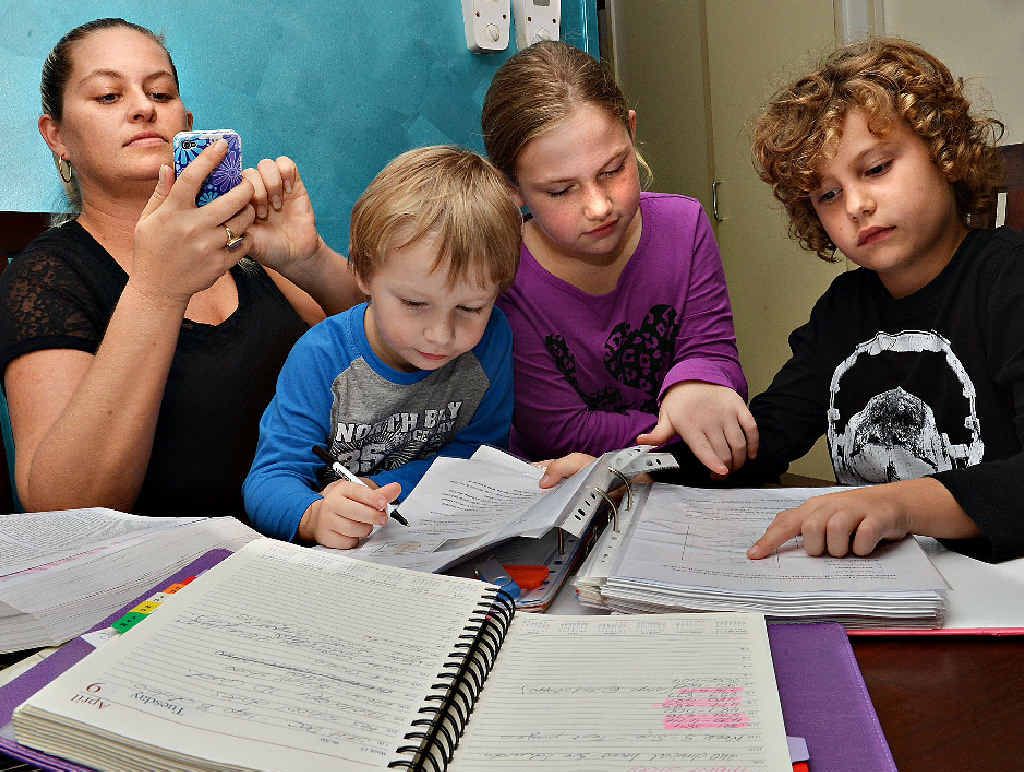 ORGANISE: Registered nurse Kobi Haddow, with children Zane, Jade and Ethan, can’t live without her smart phone’s shift worker app. ORGANISE: Registered nurse Kobi Haddow, with children Zane, Jade and Ethan, can’t live without her smart phone’s shift worker app.