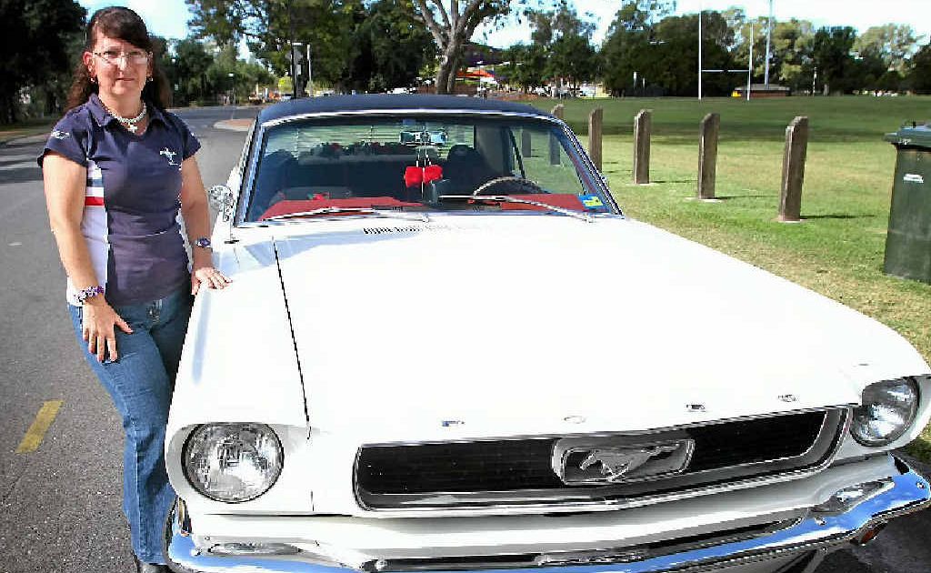 Annette Ferguson, with her 1966 Mustang Coupe, says drivers must always be aware of what is around them on the road. Annette Ferguson, with her 1966 Mustang Coupe, says drivers must always be aware of what is around them on the road.