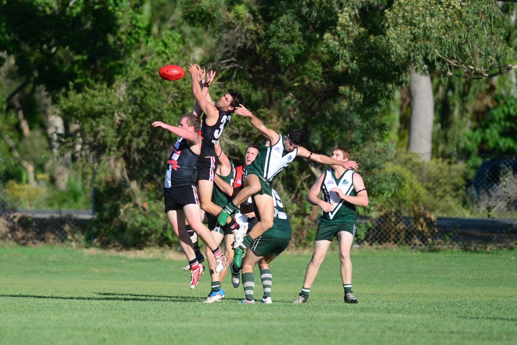 AFL Capricornia round one Gladstone Mudcrabs vs BITS Saints at Clinton Park. All in for the ball. AFL Capricornia round one Gladstone Mudcrabs vs BITS Saints at Clinton Park. All in for the ball.