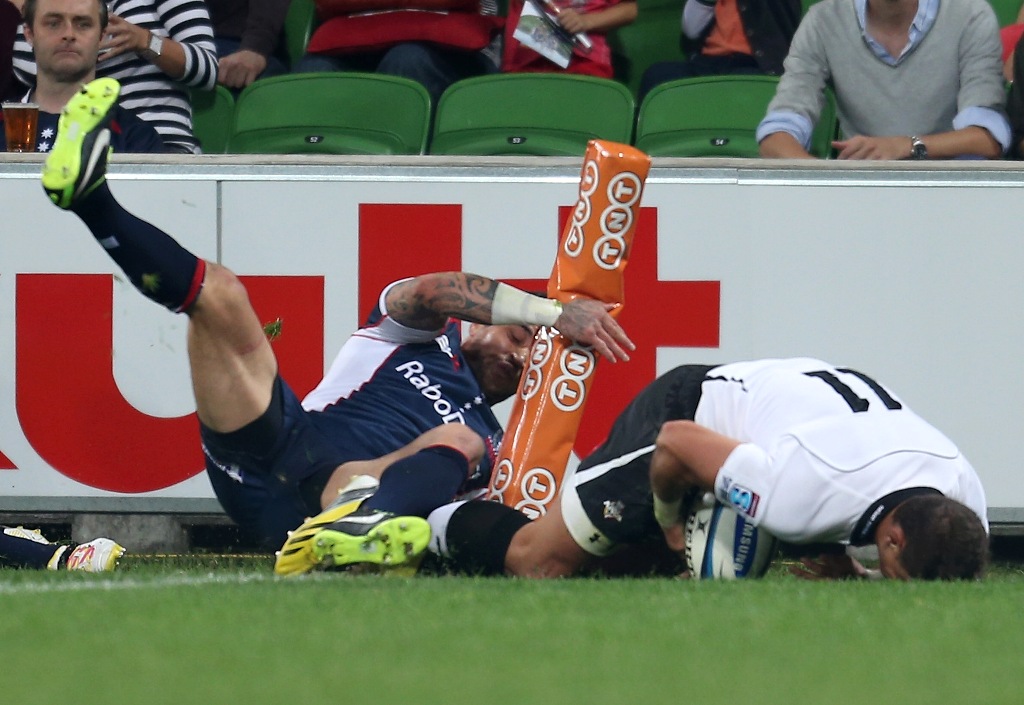 Ronnie Cooke of the Kings scores a try in the corner as Richard Kingi of the Rebels injures his knee during the round nine Super Rugby match between the Rebels and the Kings at AAMI Park on April 13, 2013 in Melbourne, Australia. Ronnie Cooke of the Kings scores a try in the corner as Richard Kingi of the Rebels injures his knee during the round nine Super Rugby match between the Rebels and the Kings at AAMI Park on April 13, 2013 in Melbourne, Australia.