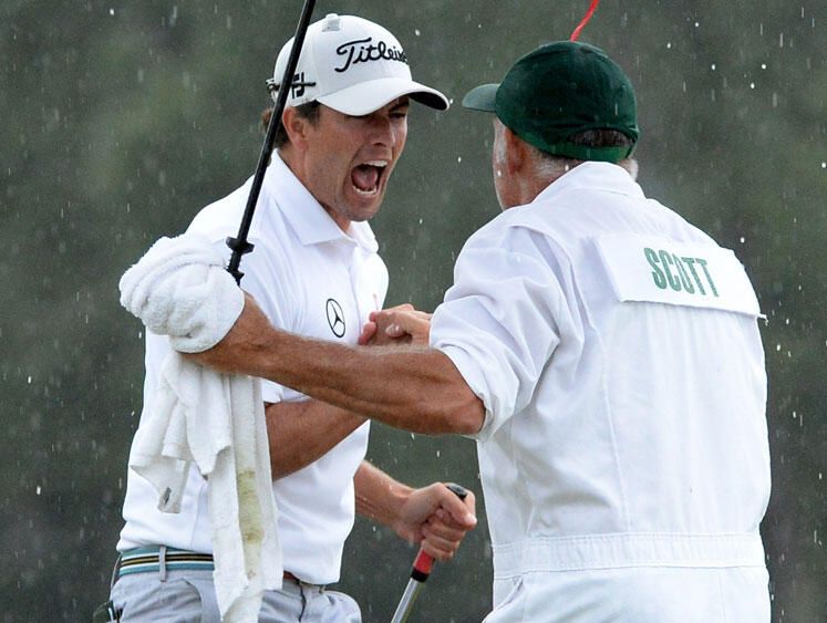 Adam Scott celebrates his historic win with his caddie. Source: Ch 7/Twitter Adam Scott celebrates his historic win with his caddie. Source: Ch 7/Twitter