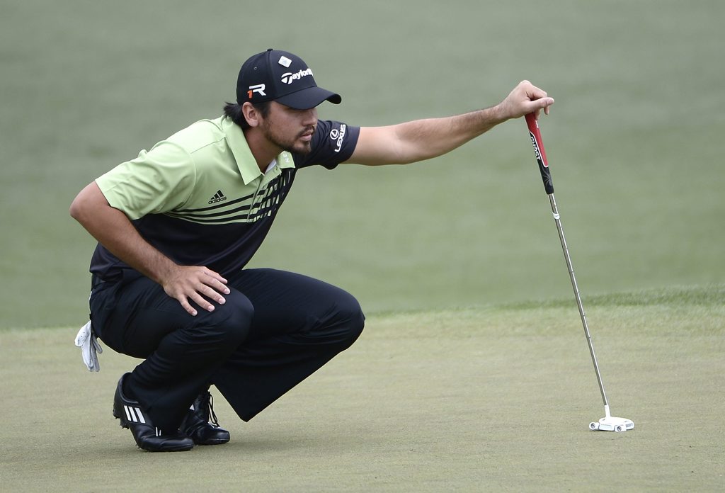 ROK120413golf.jpg Australian Jason Day lines up his putt on the second during the first round of the 2013 Masters Tournament at Augusta. Photo: AAP IMAGES.