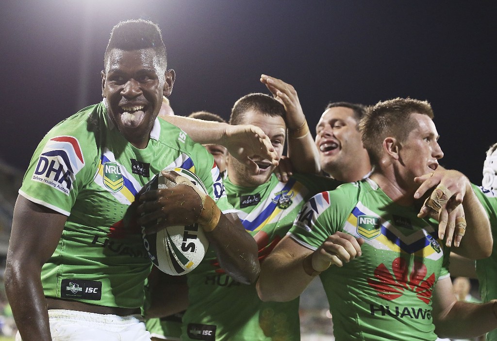 Raiders players celebrate a try by Edrick Lee (L) during the round six NRL match between the Canberra Raiders and the New Zealand Warriors at Canberra Stadium on April 13, 2013 in Canberra, Australia. Raiders players celebrate a try by Edrick Lee (L) during the round six NRL match between the Canberra Raiders and the New Zealand Warriors at Canberra Stadium on April 13, 2013 in Canberra, Australia.