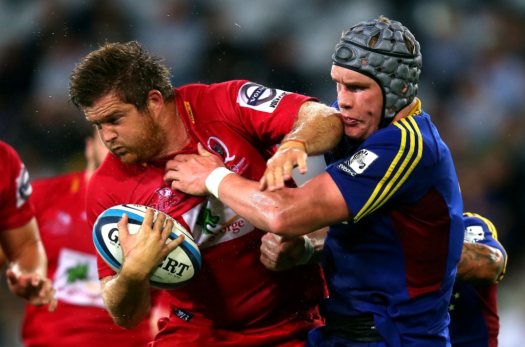 Greg Holmes of the Reds is tackled by Josh Bekhuis of the Highlanders during the round seven Super Rugby match between the Highlanders and the Reds at Forsyth Barr Stadium on March 29, 2013 in Dunedin, New Zealand. Greg Holmes of the Reds is tackled by Josh Bekhuis of the Highlanders during the round seven Super Rugby match between the Highlanders and the Reds at Forsyth Barr Stadium on March 29, 2013 in Dunedin, New Zealand.