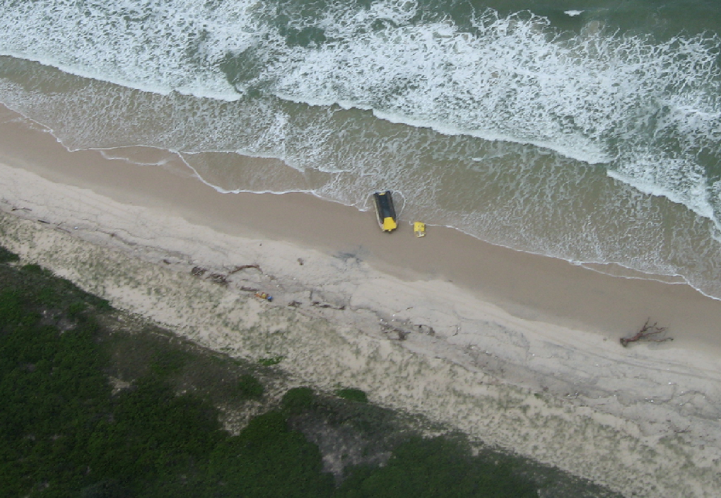 An aerial photograph of the Ballina Marine Rescue boat, which has washed up at South Ballina after flipping during a rescue yesterday morning. The photo was taken by former Ballina councillor and pilot Margaret Howes. An aerial photograph of the Ballina Marine Rescue boat, which has washed up at South Ballina after flipping during a rescue yesterday morning. The photo was taken by former Ballina councillor and pilot Margaret Howes.