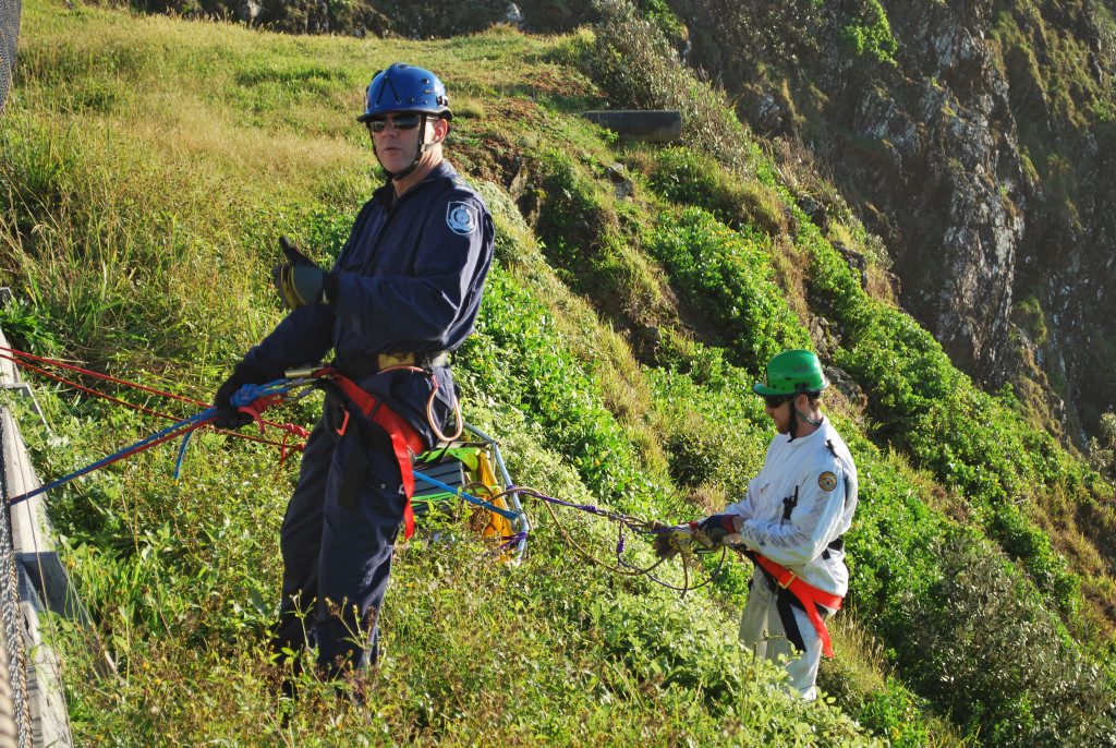 GOAT RESCUE: National Parks and Wildlife officers prepare to ascend to rescue the last remaining goat on Byron headland. GOAT RESCUE: National Parks and Wildlife officers prepare to ascend to rescue the last remaining goat on Byron headland.