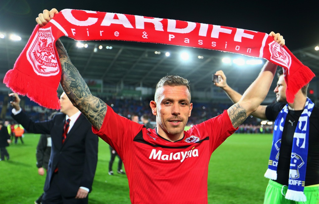 Craig Bellamy of Cardiff City celebrates his team's promotion to the Premier League at the end of the npower Championship match between Cardiff City and Charlton Athletic at the Cardiff City Stadium on April 16, 2013 in Cardiff, Wales. Craig Bellamy of Cardiff City celebrates his team's promotion to the Premier League at the end of the npower Championship match between Cardiff City and Charlton Athletic at the Cardiff City Stadium on April 16, 2013 in Cardiff, Wales.