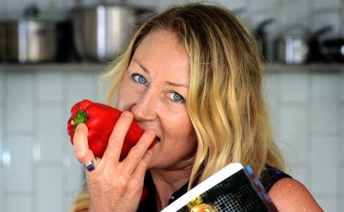 Katrina Ellis in the kitchen with her Raw vegan food. Katrina Ellis in the kitchen with her Raw vegan food.