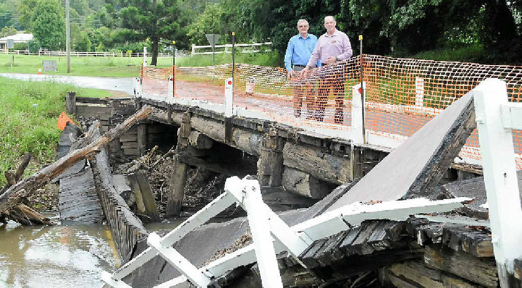 Ron Dyne and Major General Richard Wison at the Amamoor Creek Bridge after it was damaged by the 2012 flood. Ron Dyne and Major General Richard Wison at the Amamoor Creek Bridge after it was damaged by the 2012 flood.