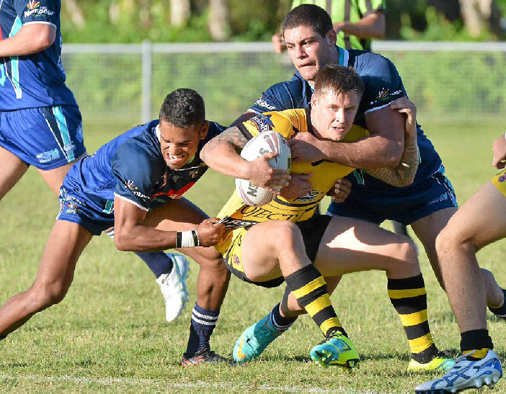 Luke Brown is wrapped up during yesterday’s clash between Caloundra and Bribie Island at Shark Park. Luke Brown is wrapped up during yesterday’s clash between Caloundra and Bribie Island at Shark Park.