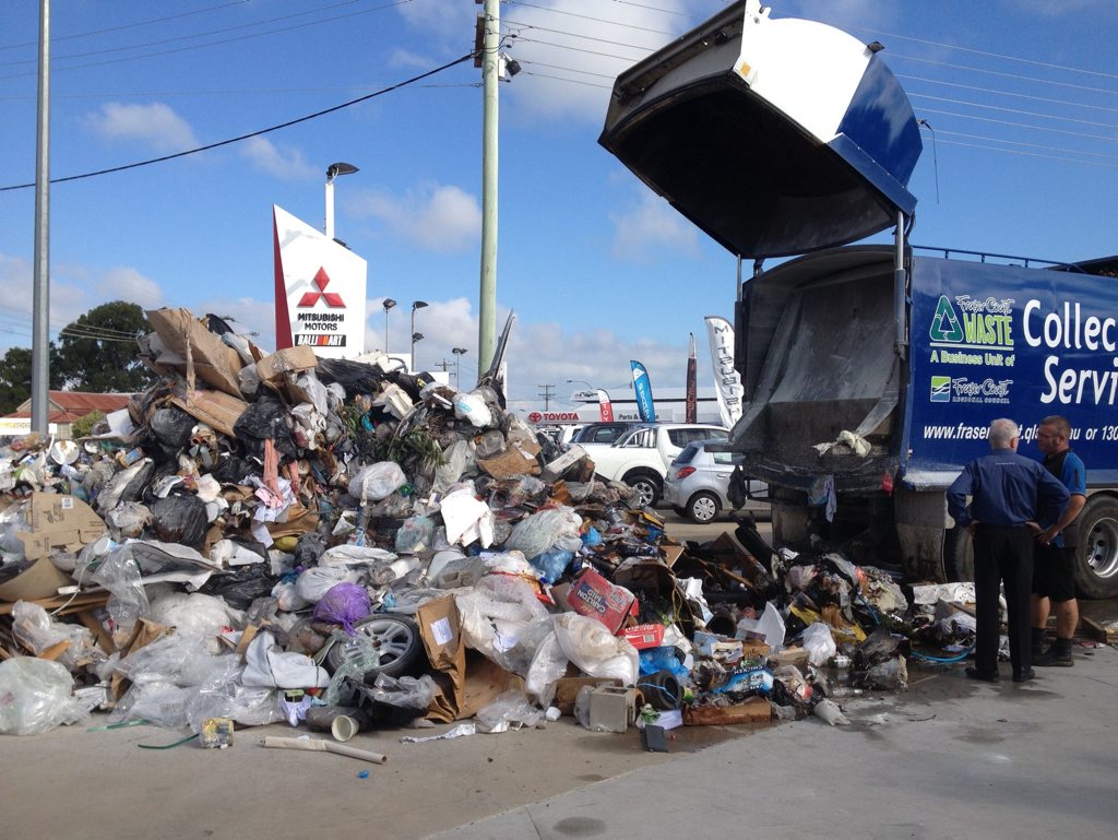 A driver dumped rubbish onto a Hervey Bay car dealership yard when the load started smoking after the truck's forks hit powerlines. A driver dumped rubbish onto a Hervey Bay car dealership yard when the load started smoking after the truck's forks hit powerlines.