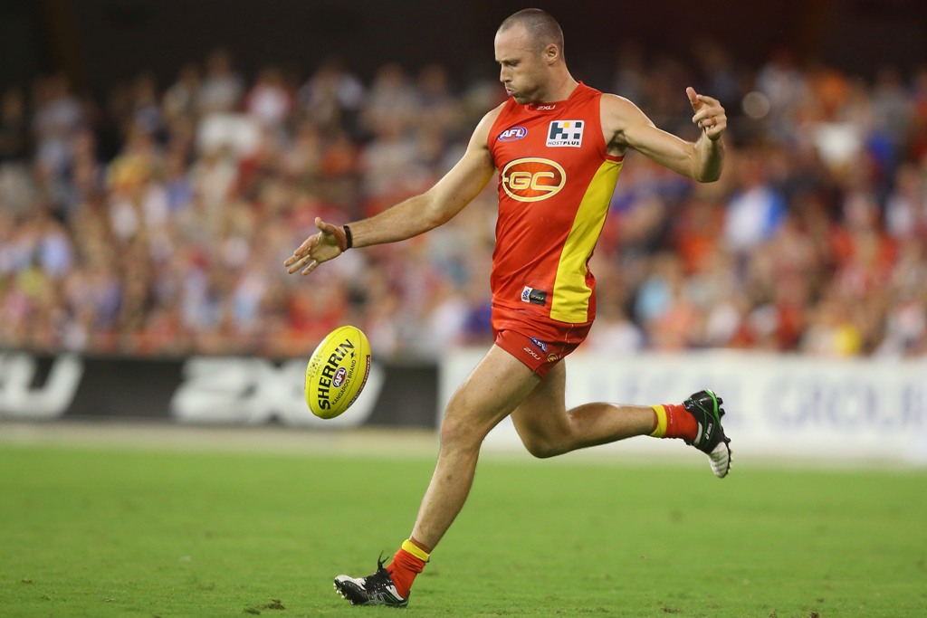 Matthew Warnock of the Suns kicks during the round one AFL match between the Gold Coast Suns and the St Kilda Saints at Metricon Stadium on March 30, 2013 in Gold Coast, Australia. Matthew Warnock of the Suns kicks during the round one AFL match between the Gold Coast Suns and the St Kilda Saints at Metricon Stadium on March 30, 2013 in Gold Coast, Australia.