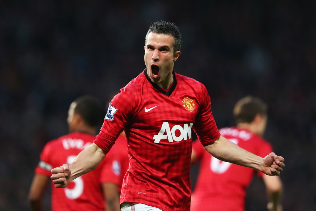 Robin van Persie of Manchester United celebrates scoring the opening goal during the Barclays Premier League match between Manchester United and Aston Villa at Old Trafford on April 22, 2013 in Manchester, England. Robin van Persie of Manchester United celebrates scoring the opening goal during the Barclays Premier League match between Manchester United and Aston Villa at Old Trafford on April 22, 2013 in Manchester, England.