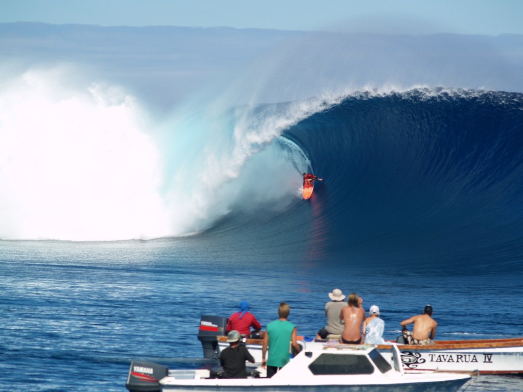 A surfer enjoying the waves at Cloudbreak in Fiji. A surfer enjoying the waves at Cloudbreak in Fiji.