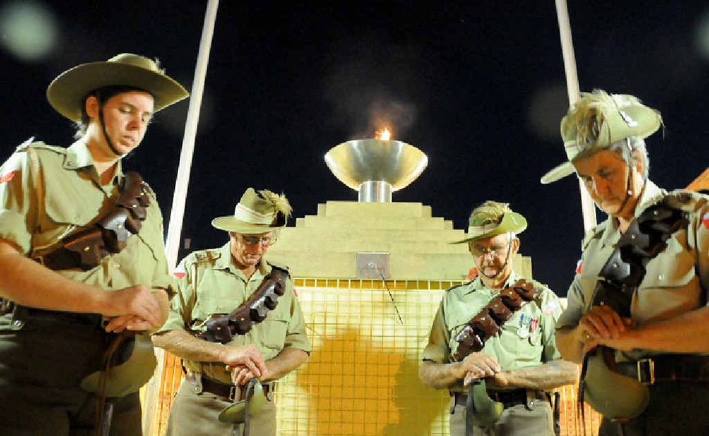 The Memorial Flame in Reef St was lit on Wednesday night ahead of yesterday’s dawn service. Standing guard were 5th Light Horse Regiment Gympie Troop members (from left) Sgt Sue Chapman, Troop Commander Jim Boyle, Trooper Des Schmidt and Trooper Shirley Chapman. The Memorial Flame in Reef St was lit on Wednesday night ahead of yesterday’s dawn service. Standing guard were 5th Light Horse Regiment Gympie Troop members (from left) Sgt Sue Chapman, Troop Commander Jim Boyle, Trooper Des Schmidt and Trooper Shirley Chapman.