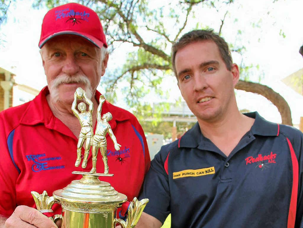 ANZAC MATCH: Colin Pope and Gavin O’Leary proudly hold the Anzac Day trophy the Redbacks have won since 2007.
