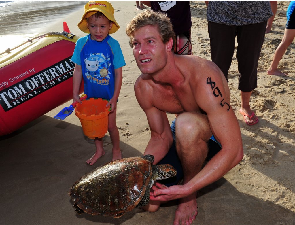 Bondi Vet. Dr. Chris Brown was at the right place at the right time when he was called to attend to a sick turtle that had been plucked from the water by Noosa Heads SLSC IRB driver Richard Webber during the 3.8km Ocean Swim at Main Beach Noosa . Geoff Potter/ Noosa News Bondi Vet. Dr. Chris Brown was at the right place at the right time when he was called to attend to a sick turtle that had been plucked from the water by Noosa Heads SLSC IRB driver Richard Webber during the 3.8km Ocean Swim at Main Beach Noosa . Geoff Potter/ Noosa News