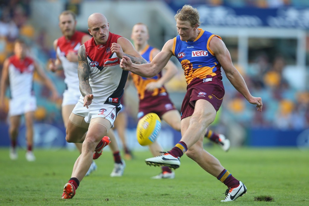 Mitch Golby of the Lions kicks during the round five AFL match between the Brisbane Lions and the Melbourne Demons at The Gabba on April 28, 2013 in Brisbane, Australia. Mitch Golby of the Lions kicks during the round five AFL match between the Brisbane Lions and the Melbourne Demons at The Gabba on April 28, 2013 in Brisbane, Australia.