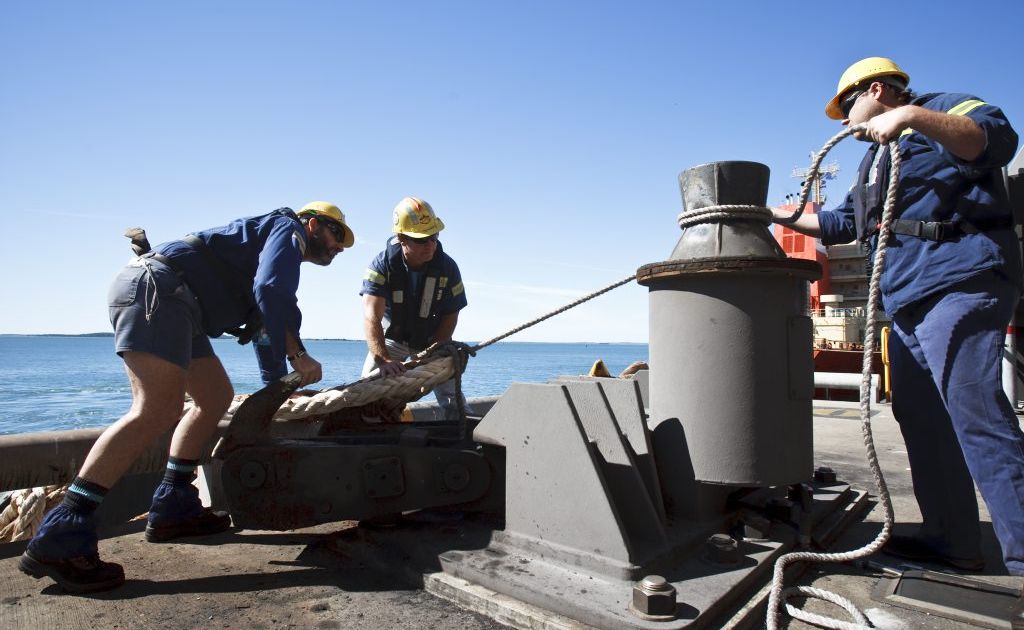 ON THE WHARF: Gladstone Ports Corporation workers tie off a bulk carrier. Photo contributed ON THE WHARF: Gladstone Ports Corporation workers tie off a bulk carrier. Photo contributed