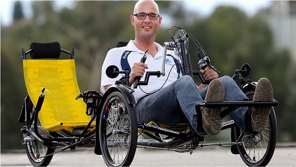 Dr Ian Davis in his customer made tandem bike, preparing for 'million meters' ride. Dr Ian Davis in his customer made tandem bike, preparing for 'million meters' ride.