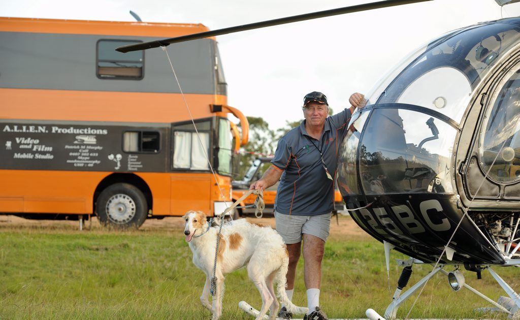 First timer for a CMCA rally Patrick Murphy and his pup Reno. Patrick stands in front of his helicopter and his bus with a heli landing pad on the roof. First timer for a CMCA rally Patrick Murphy and his pup Reno. Patrick stands in front of his helicopter and his bus with a heli landing pad on the roof.