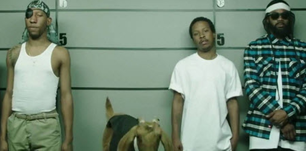 A still from the advert showing the line up of suspects. A still from the advert showing the line up of suspects.
