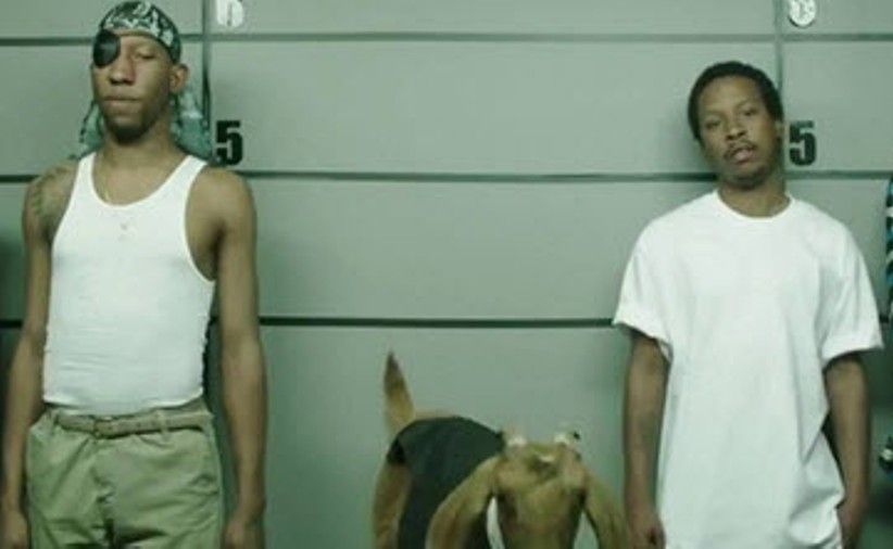 A still from the advert showing the line up of suspects. A still from the advert showing the line up of suspects.