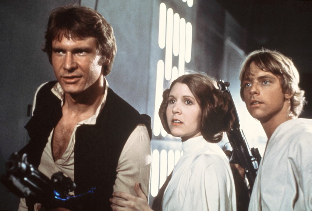 This publicity film image provided by 20th Century-Fox Film Corporation shows, from left, Harrison Ford as Han Solo, Carrie Fisher as Princess Leia Organa and Mark Hamill as Luke Skywalker in a scene from Star Wars, which was released by 20th Century-Fox in 1977. This publicity film image provided by 20th Century-Fox Film Corporation shows, from left, Harrison Ford as Han Solo, Carrie Fisher as Princess Leia Organa and Mark Hamill as Luke Skywalker in a scene from Star Wars, which was released by 20th Century-Fox in 1977.