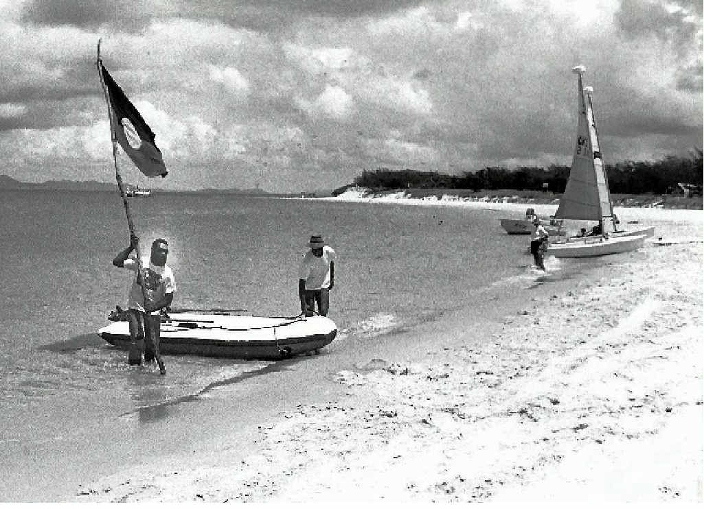 BELOW LEFT: Aboriginal elder Bob Muir places an Aboriginal flag on Great Keppel Island on Australia Day, 1993. BELOW LEFT: Aboriginal elder Bob Muir places an Aboriginal flag on Great Keppel Island on Australia Day, 1993.