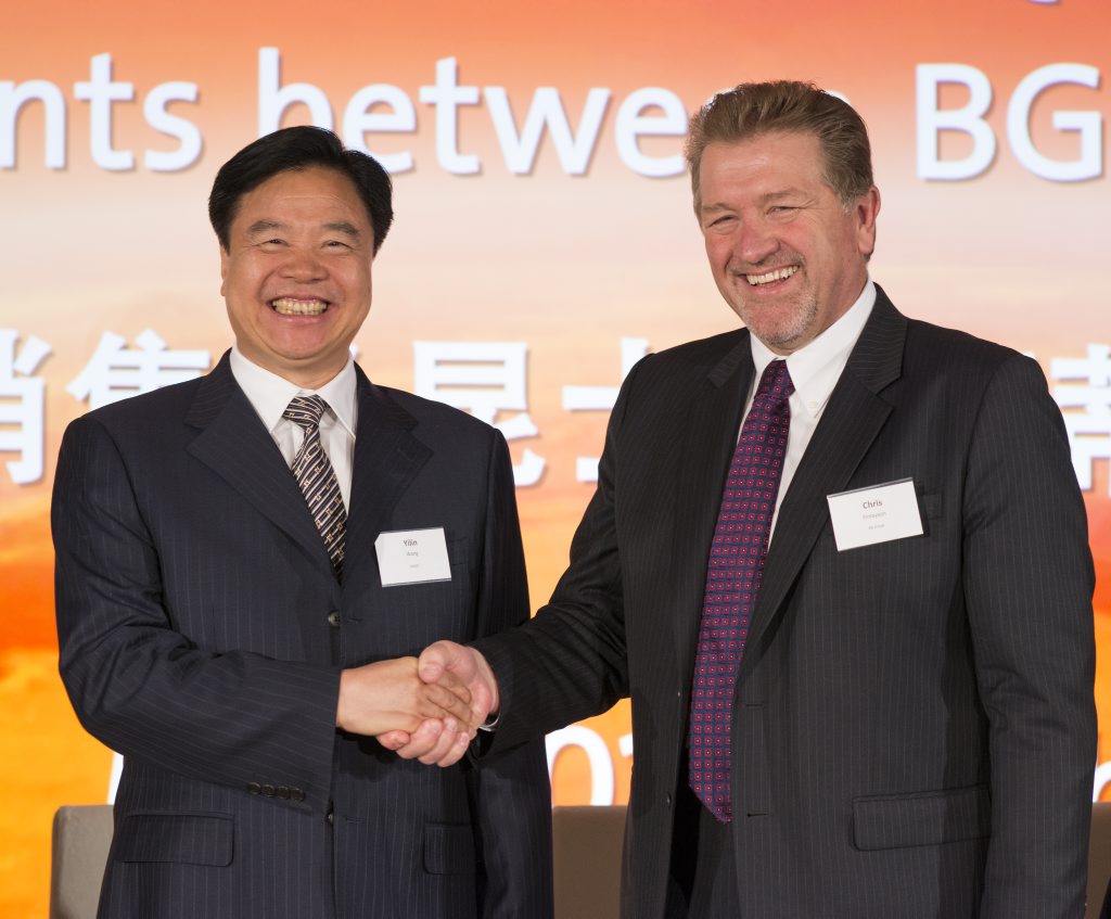 Wang Yilin of China National Offshore Oil Corporation and BG Group Chief Executive Chris Finlayson shake on the QCLNG deal. Photo Contributed Wang Yilin of China National Offshore Oil Corporation and BG Group Chief Executive Chris Finlayson shake on the QCLNG deal. Photo Contributed
