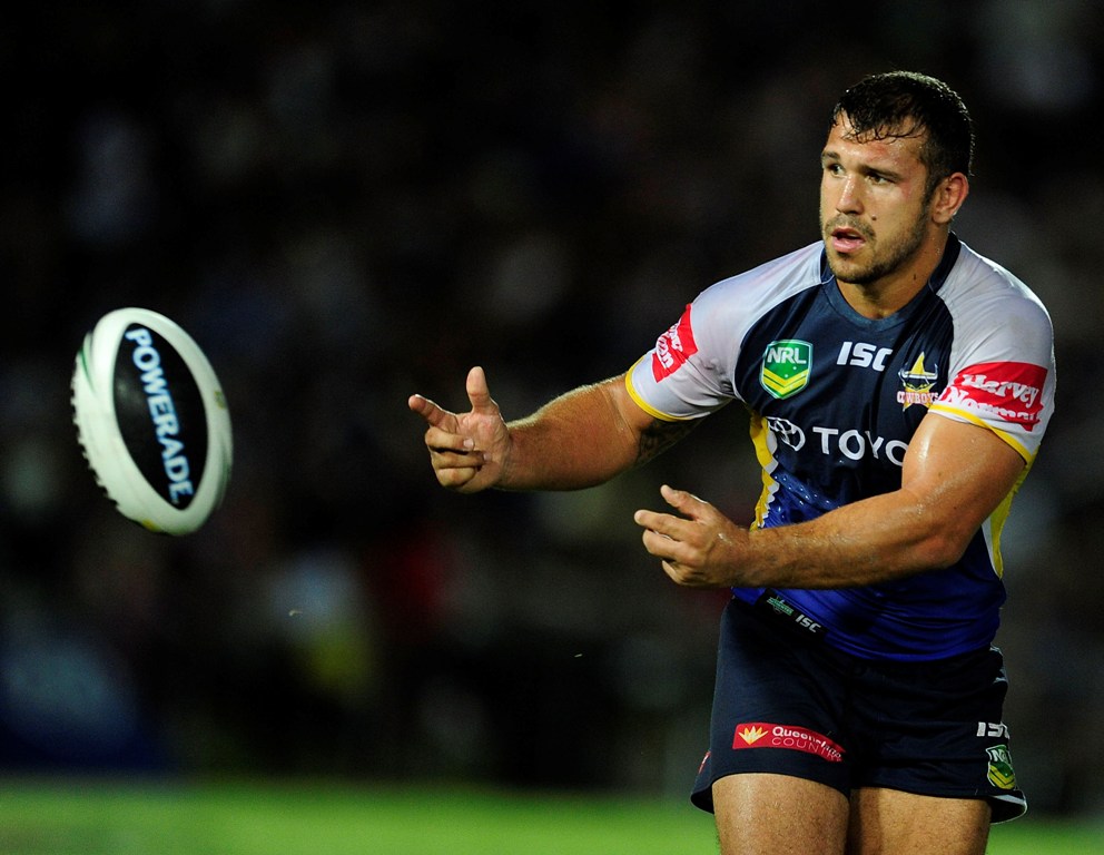 Scott Moore of the Cowboys passes the ball during the round two NRL match between the North Queensland Cowboys and the Melbourne Storm at 1300SMILES Stadium on March 16, 2013 in Townsville, Australia. Scott Moore of the Cowboys passes the ball during the round two NRL match between the North Queensland Cowboys and the Melbourne Storm at 1300SMILES Stadium on March 16, 2013 in Townsville, Australia.