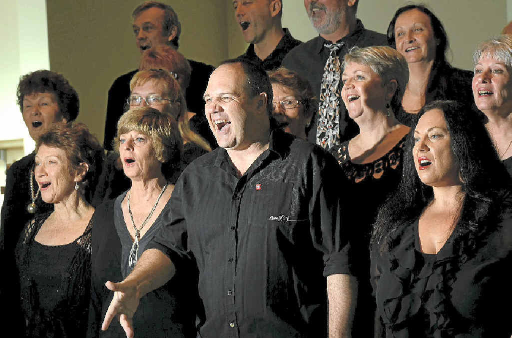 Voice Weavers' musical director Brett Logan with the singers practising at St Augustine’s church before their trip to Vietnam.