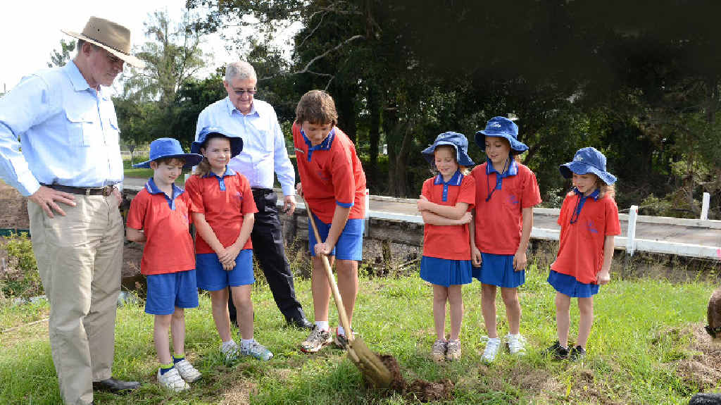 Major General Richard Wilson and Gympie Mayor Ron Dyne get some help from Amamoor Primary School students Dawson Kilpatrick, Emma Story, Lewis Maudsley, Catherine Tidy, Georgia Brunskill and Miranda Robb to turn the first sod on the new Amamoor Creek bridge. Major General Richard Wilson and Gympie Mayor Ron Dyne get some help from Amamoor Primary School students Dawson Kilpatrick, Emma Story, Lewis Maudsley, Catherine Tidy, Georgia Brunskill and Miranda Robb to turn the first sod on the new Amamoor Creek bridge.