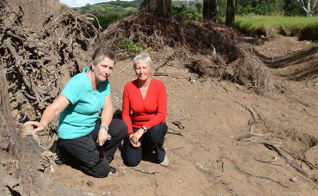Sharen Armstrong and Christene Andersen want council to fix a flood problem causing massive erosion on their Amamoor Creek Rd properties. Sharen Armstrong and Christene Andersen want council to fix a flood problem causing massive erosion on their Amamoor Creek Rd properties.