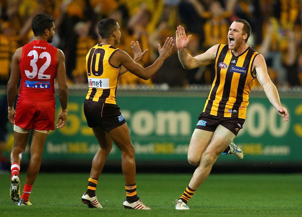 Jarryd Roughead of the Hawks is congratulated by Bradley Hill of the Hawks after kicking a goal during the round seven AFL match between the Hawthorn Hawks and the Sydney Swans at Melbourne Cricket Ground on May 11, 2013 in Melbourne, Australia. Jarryd Roughead of the Hawks is congratulated by Bradley Hill of the Hawks after kicking a goal during the round seven AFL match between the Hawthorn Hawks and the Sydney Swans at Melbourne Cricket Ground on May 11, 2013 in Melbourne, Australia.