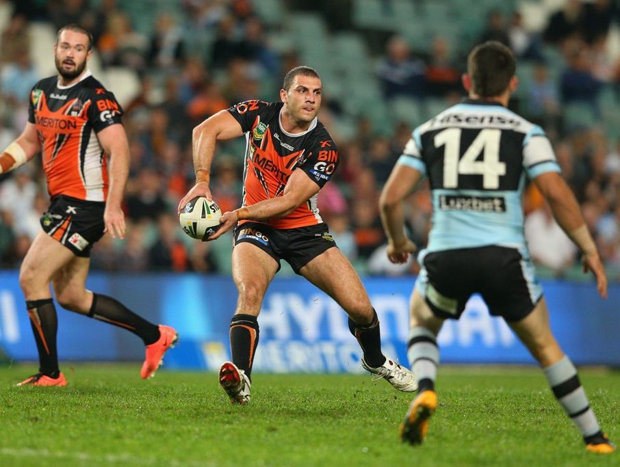 Robbie Farah of the Tigers passes during the round nine NRL match between the Wests Tigers and the Cronulla Sharks at Allianz Stadium on May 10, 2013 in Sydney, Australia. Robbie Farah of the Tigers passes during the round nine NRL match between the Wests Tigers and the Cronulla Sharks at Allianz Stadium on May 10, 2013 in Sydney, Australia.