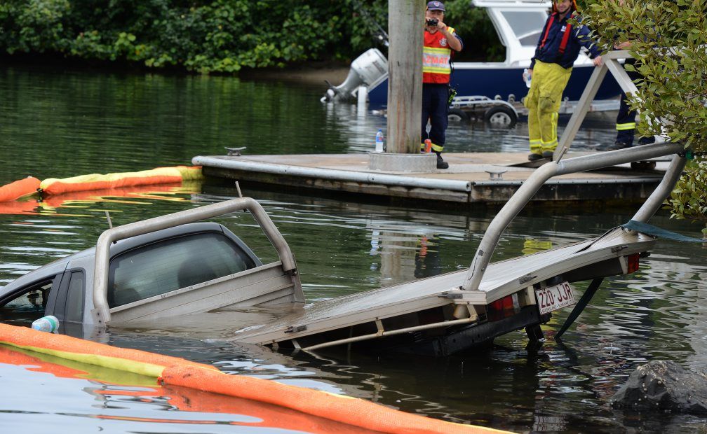 Stolen car in the Tweed river, Fingal boat harbour. Photo: John Gass / Daily News Stolen car in the Tweed river, Fingal boat harbour. Photo: John Gass / Daily News