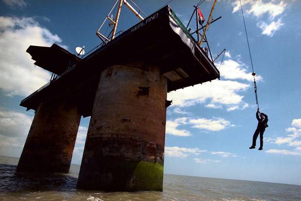 The only way up to the micro island of Sealand is by a swing seat suspended by a winch. The only way up to the micro island of Sealand is by a swing seat suspended by a winch.